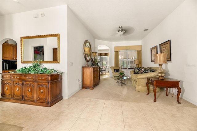 91 Breeze Hill Ln, Palm Coast, FL 32137 - corridor with arched walkways, carpet, tile patterned floors, and baseboards