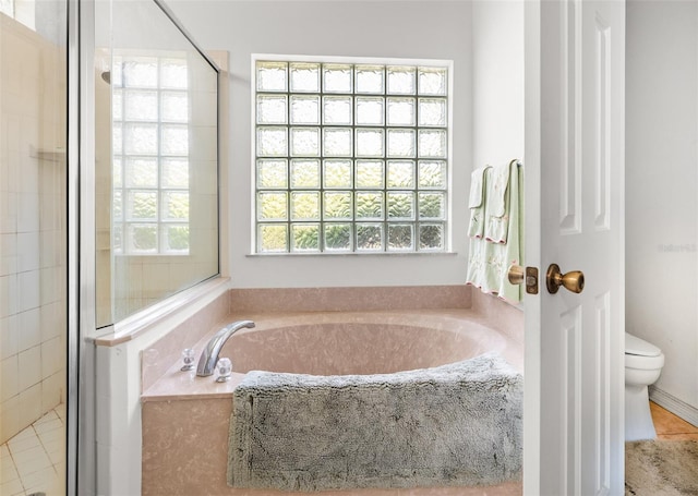 91 Breeze Hill Ln, Palm Coast, FL 32137 - full bath with toilet, a garden tub, and a shower stall