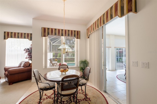 91 Breeze Hill Ln, Palm Coast, FL 32137 - dining space with a chandelier and light tile patterned floors