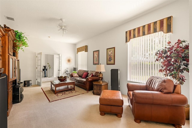 91 Breeze Hill Ln, Palm Coast, FL 32137 - living room featuring light colored carpet and plenty of natural light