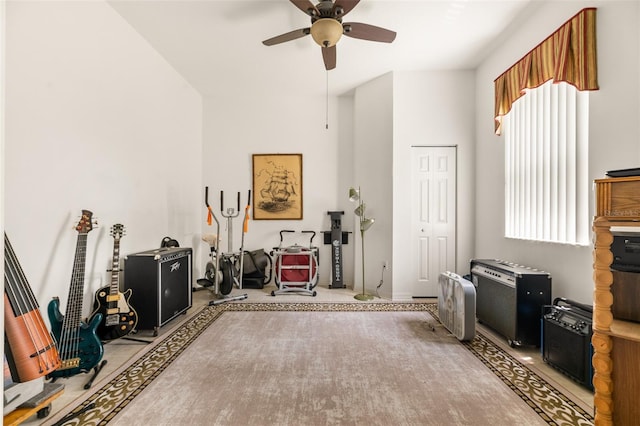 91 Breeze Hill Ln, Palm Coast, FL 32137 - living area featuring a ceiling fan, a towering ceiling, and baseboards