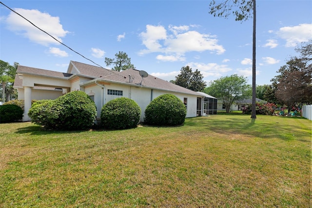 91 Breeze Hill Ln, Palm Coast, FL 32137 - view of side of property featuring a lawn and stucco siding