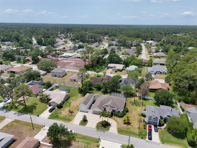 91 Breeze Hill Ln, Palm Coast, FL 32137 - aerial perspective of suburban area with a heavily wooded area