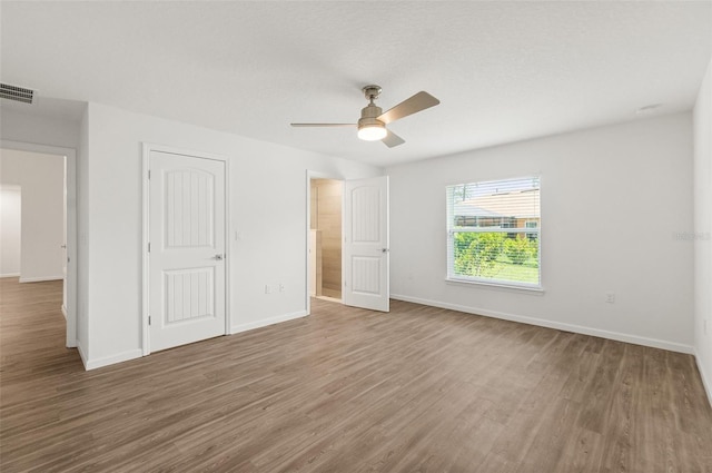19 Ethel Ln, Palm Coast, FL 32164 - unfurnished bedroom with wood finished floors, baseboards, a closet, and ceiling fan