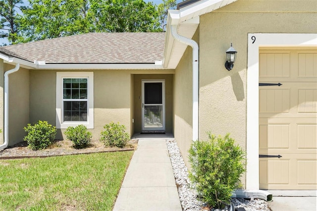 9 Waldron Pl, Palm Coast, FL 32164 - property entrance with roof with shingles and stucco siding