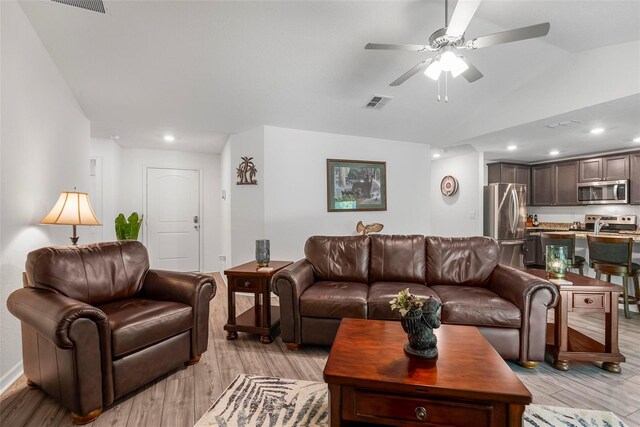 9 Waldron Pl, Palm Coast, FL 32164 - living room featuring a ceiling fan, light wood-style floors, lofted ceiling, and recessed lighting