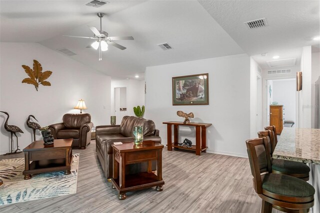 9 Waldron Pl, Palm Coast, FL 32164 - living room featuring a ceiling fan, light wood finished floors, lofted ceiling, baseboards, and recessed lighting