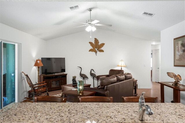 9 Waldron Pl, Palm Coast, FL 32164 - living area featuring a ceiling fan, lofted ceiling, wood finished floors, and baseboards