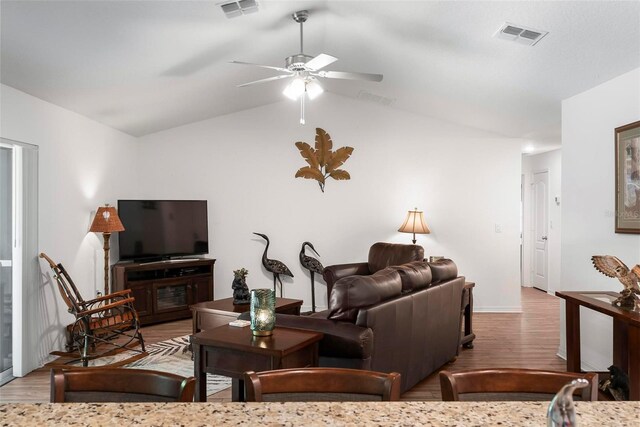 9 Waldron Pl, Palm Coast, FL 32164 - living area featuring wood finished floors, a ceiling fan, lofted ceiling, and baseboards