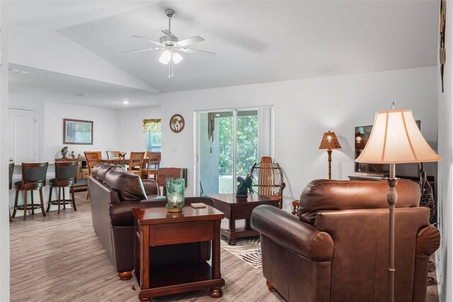 9 Waldron Pl, Palm Coast, FL 32164 - living area featuring lofted ceiling, light wood finished floors, and ceiling fan