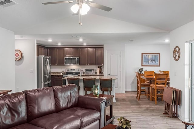9 Waldron Pl, Palm Coast, FL 32164 - living area featuring vaulted ceiling, ceiling fan, light wood-style floors, and recessed lighting