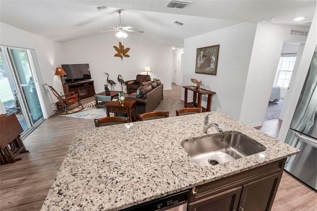 9 Waldron Pl, Palm Coast, FL 32164 - kitchen with a sink, freestanding refrigerator, lofted ceiling, plenty of natural light, and ceiling fan