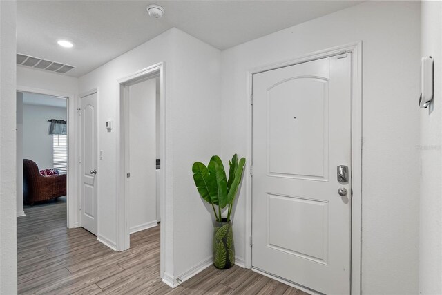 9 Waldron Pl, Palm Coast, FL 32164 - foyer with light wood finished floors and baseboards