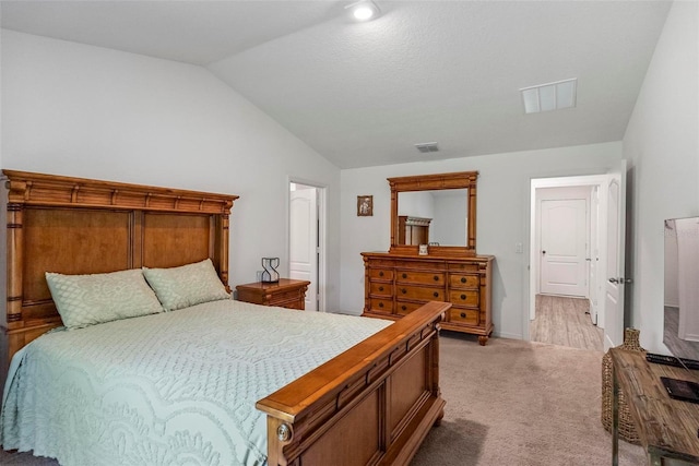 9 Waldron Pl, Palm Coast, FL 32164 - bedroom with lofted ceiling, light carpet, and baseboards