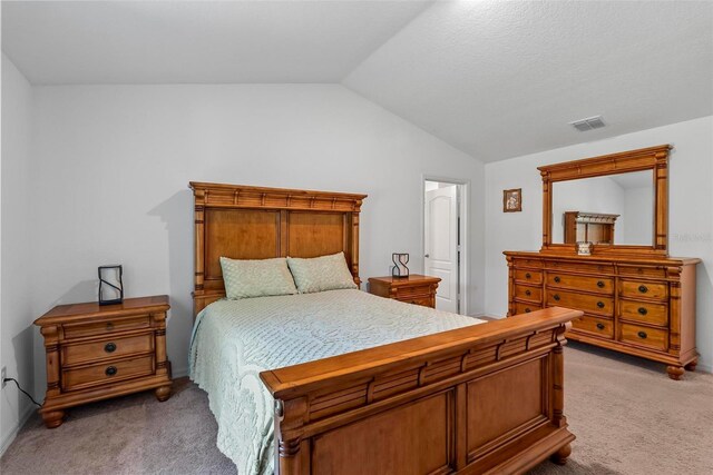 9 Waldron Pl, Palm Coast, FL 32164 - bedroom with light colored carpet and vaulted ceiling