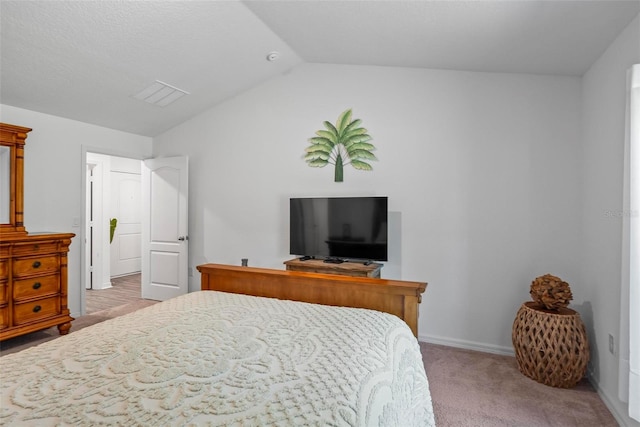 9 Waldron Pl, Palm Coast, FL 32164 - bedroom with carpet, vaulted ceiling, and baseboards