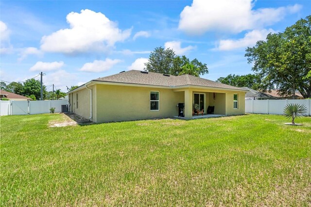 9 Waldron Pl, Palm Coast, FL 32164 - rear view of property with stucco siding and a patio area