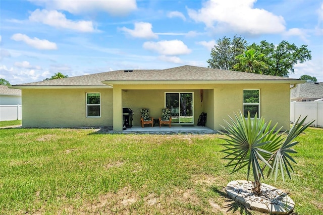 9 Waldron Pl, Palm Coast, FL 32164 - rear view of house featuring stucco siding, a patio area, and a shingled roof