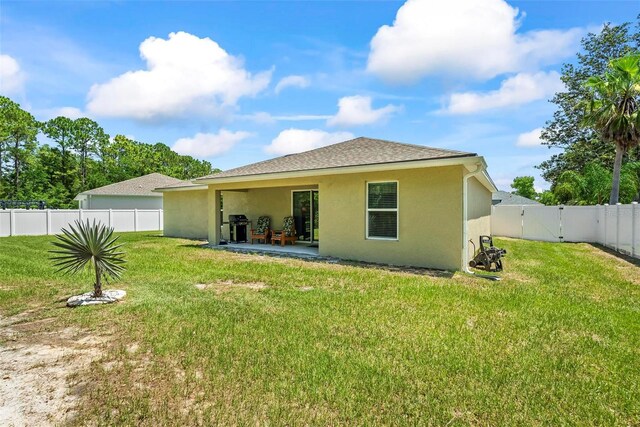 9 Waldron Pl, Palm Coast, FL 32164 - rear view of property with stucco siding, a shingled roof, a patio, and a gate