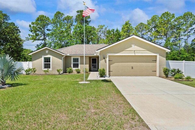 9 Waldron Pl, Palm Coast, FL 32164 - ranch-style home with stucco siding, an attached garage, and concrete driveway