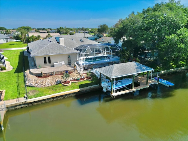 4 Cotton Ct, Palm Coast, FL 32137 - dock area featuring boat lift, a patio, a swimming pool, a water view, and a lawn