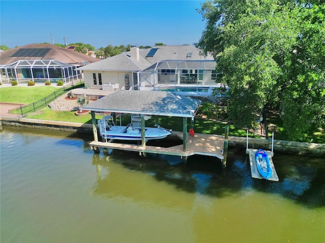 4 Cotton Ct, Palm Coast, FL 32137 - dock area with boat lift, a water view, an outdoor pool, glass enclosure, and a patio area