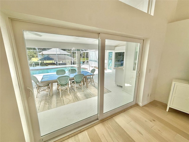 4 Cotton Ct, Palm Coast, FL 32137 - doorway with wood finished floors and a sunroom
