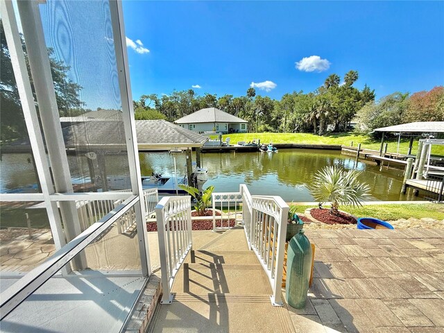 4 Cotton Ct, Palm Coast, FL 32137 - dock area featuring a water view and view of scattered trees