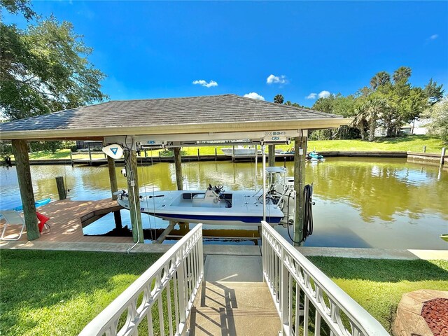 4 Cotton Ct, Palm Coast, FL 32137 - dock area featuring boat lift, a water view, and a yard
