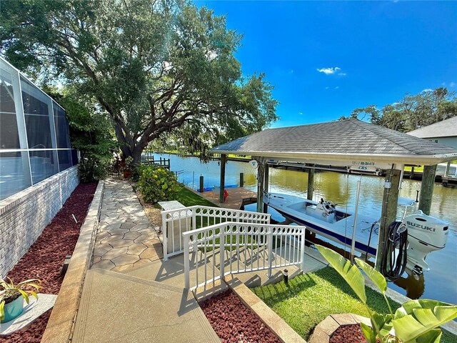 4 Cotton Ct, Palm Coast, FL 32137 - dock area featuring boat lift, a water view, and a lanai