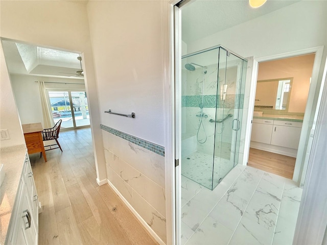 4 Cotton Ct, Palm Coast, FL 32137 - bathroom featuring vanity, a stall shower, ceiling fan, and wood finished floors