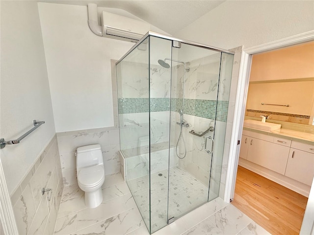 4 Cotton Ct, Palm Coast, FL 32137 - full bathroom with an AC wall unit, toilet, marble look tiles, a marble finish shower, and vanity