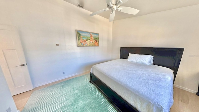 4 Cotton Ct, Palm Coast, FL 32137 - bedroom with baseboards, ceiling fan, and light wood-style floors