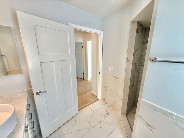 4 Cotton Ct, Palm Coast, FL 32137 - full bath with marble look tile flooring, a marble finish shower, and vanity