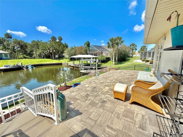 4 Cotton Ct, Palm Coast, FL 32137 - view of patio / terrace with a water view, a boat dock, boat lift, and view of wooded area