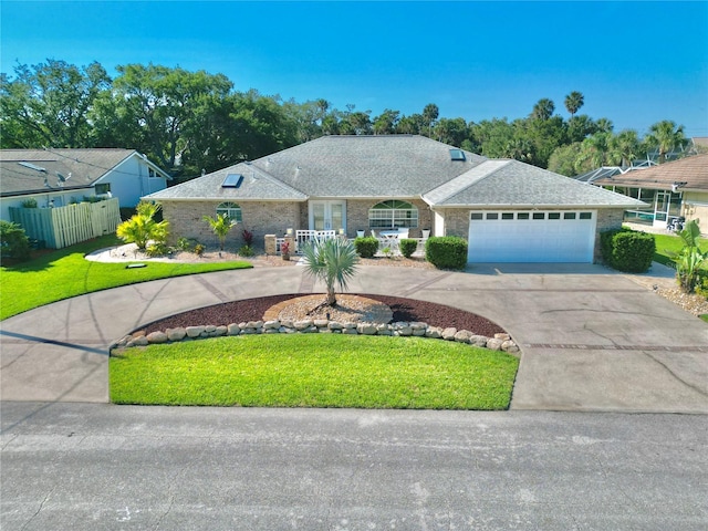 4 Cotton Ct, Palm Coast, FL 32137 - ranch-style home featuring curved driveway and an attached garage