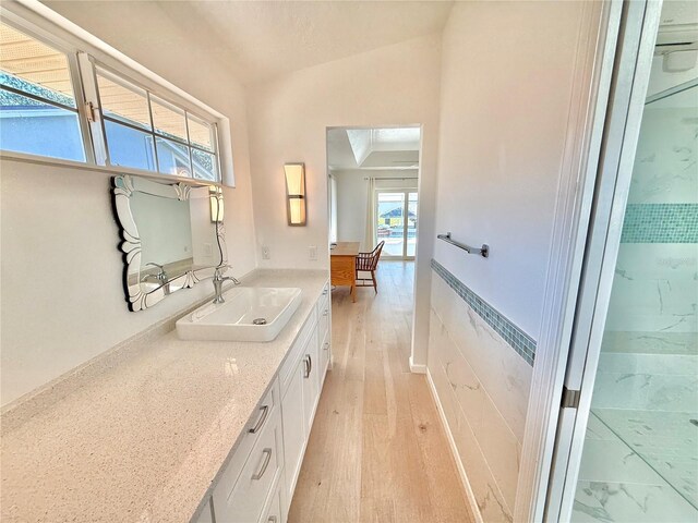 4 Cotton Ct, Palm Coast, FL 32137 - bathroom featuring vanity, lofted ceiling, and wood finished floors