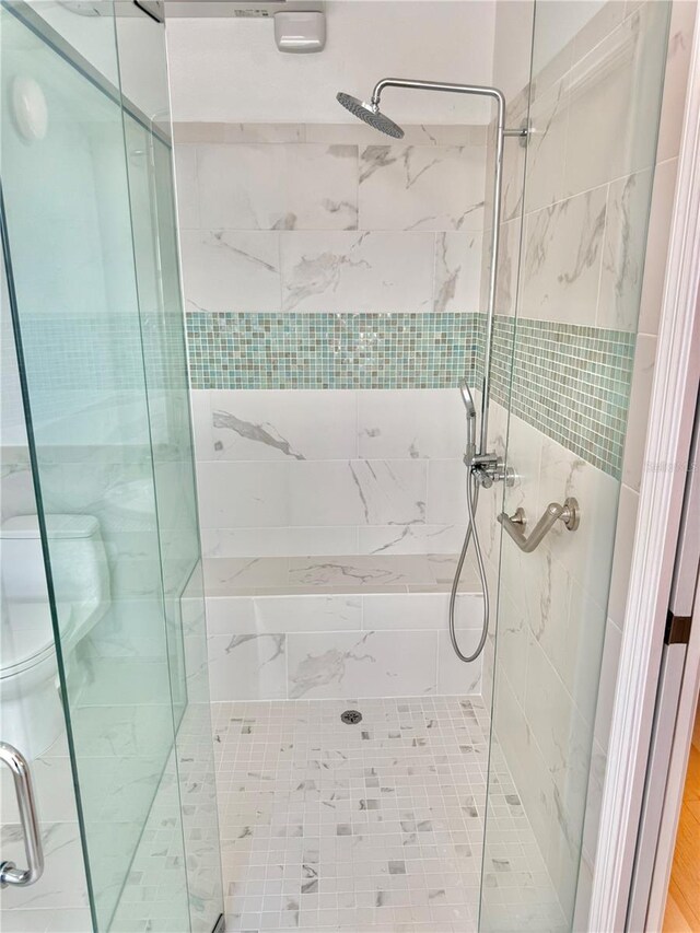 4 Cotton Ct, Palm Coast, FL 32137 - bathroom featuring a stall shower and toilet