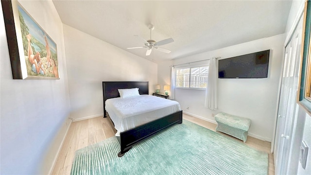 4 Cotton Ct, Palm Coast, FL 32137 - bedroom with baseboards, wood finished floors, and a ceiling fan