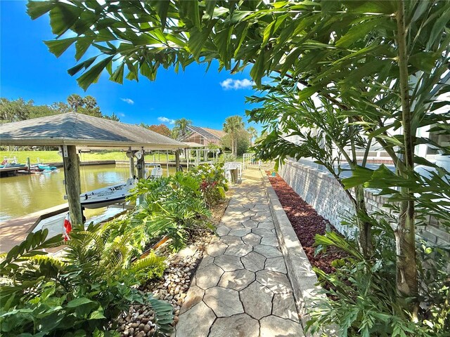 4 Cotton Ct, Palm Coast, FL 32137 - dock featuring boat lift and a water view