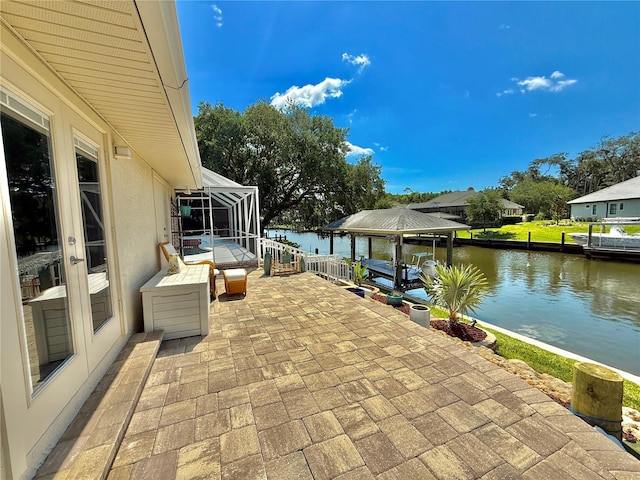 4 Cotton Ct, Palm Coast, FL 32137 - view of patio / terrace with a water view, glass enclosure, and a gazebo