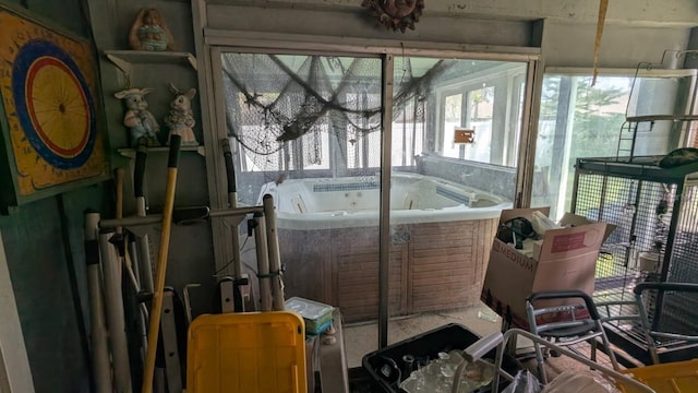 20 Eastgate Ln, Palm Coast, FL 32164 - sunroom featuring a jacuzzi