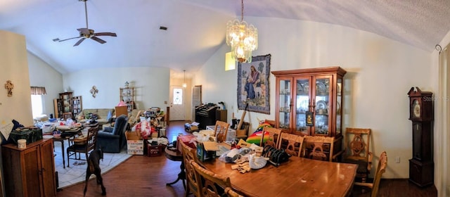 20 Eastgate Ln, Palm Coast, FL 32164 - dining space featuring lofted ceiling, wood finished floors, a ceiling fan, and a chandelier
