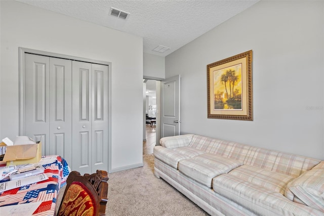 123 N Starling Dr, Palm Coast, FL 32164 - carpeted bedroom with a closet, baseboards, and a textured ceiling