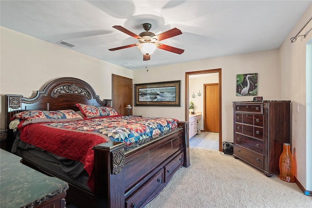 bedroom featuring light carpet and a ceiling fan