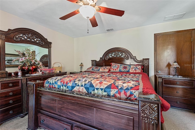 bedroom with light carpet and a ceiling fan