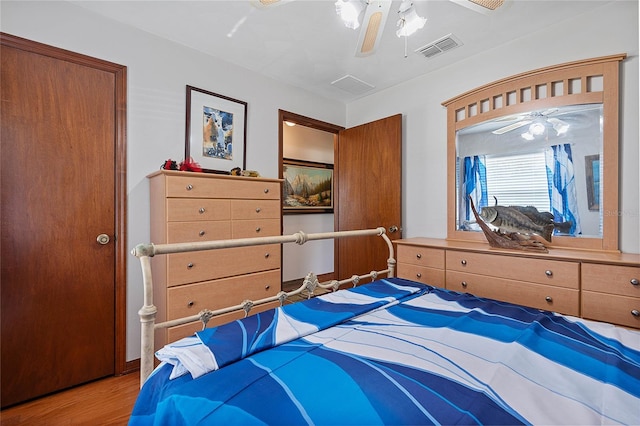 bedroom with wood finished floors and ceiling fan