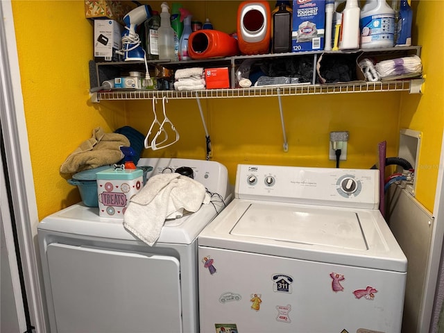 laundry room with independent washer and dryer