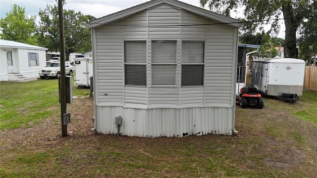 view of home's exterior with a yard