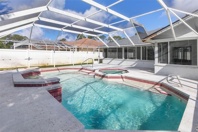 view of pool with a patio area, a pool with connected hot tub, a sunroom, and fence